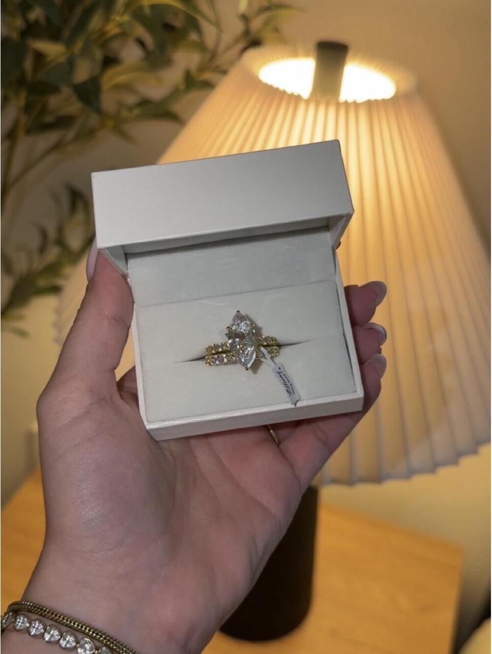 Diamond engagement ring with yellow gold diamond band